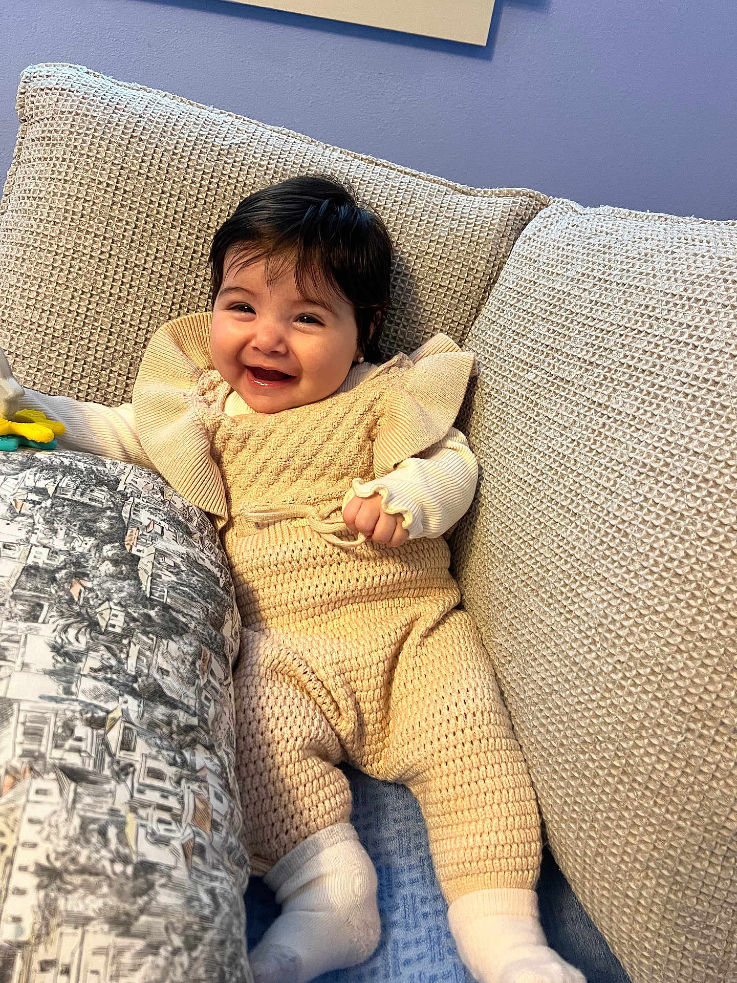 Isabella joined the competition — help win amazing prizes! baby, smile, couch, cushion, knitwear, infant, happy, child, socks, indoor, portrait, person, cozy, home, seated, cute, young, textile, comfort, playful