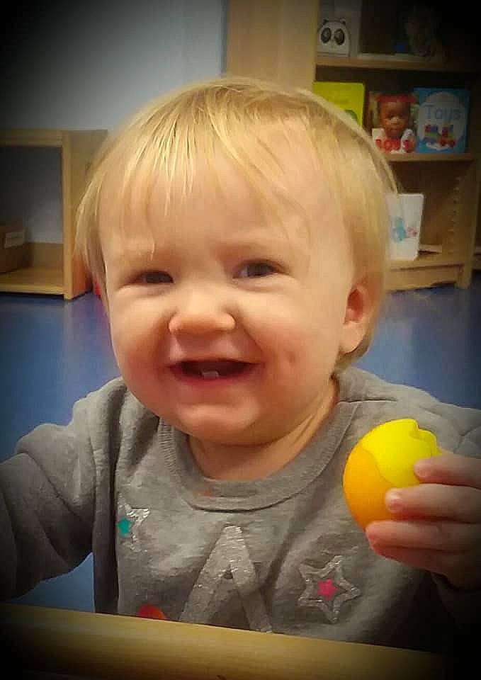 Chelsea is registered to the contest to win money with this photo: baby, cheek, child, eye, face, facial_expression, fun, head, iris, laugh, lip, mouth, nose, person, play, skin, smile, toddler, yellow