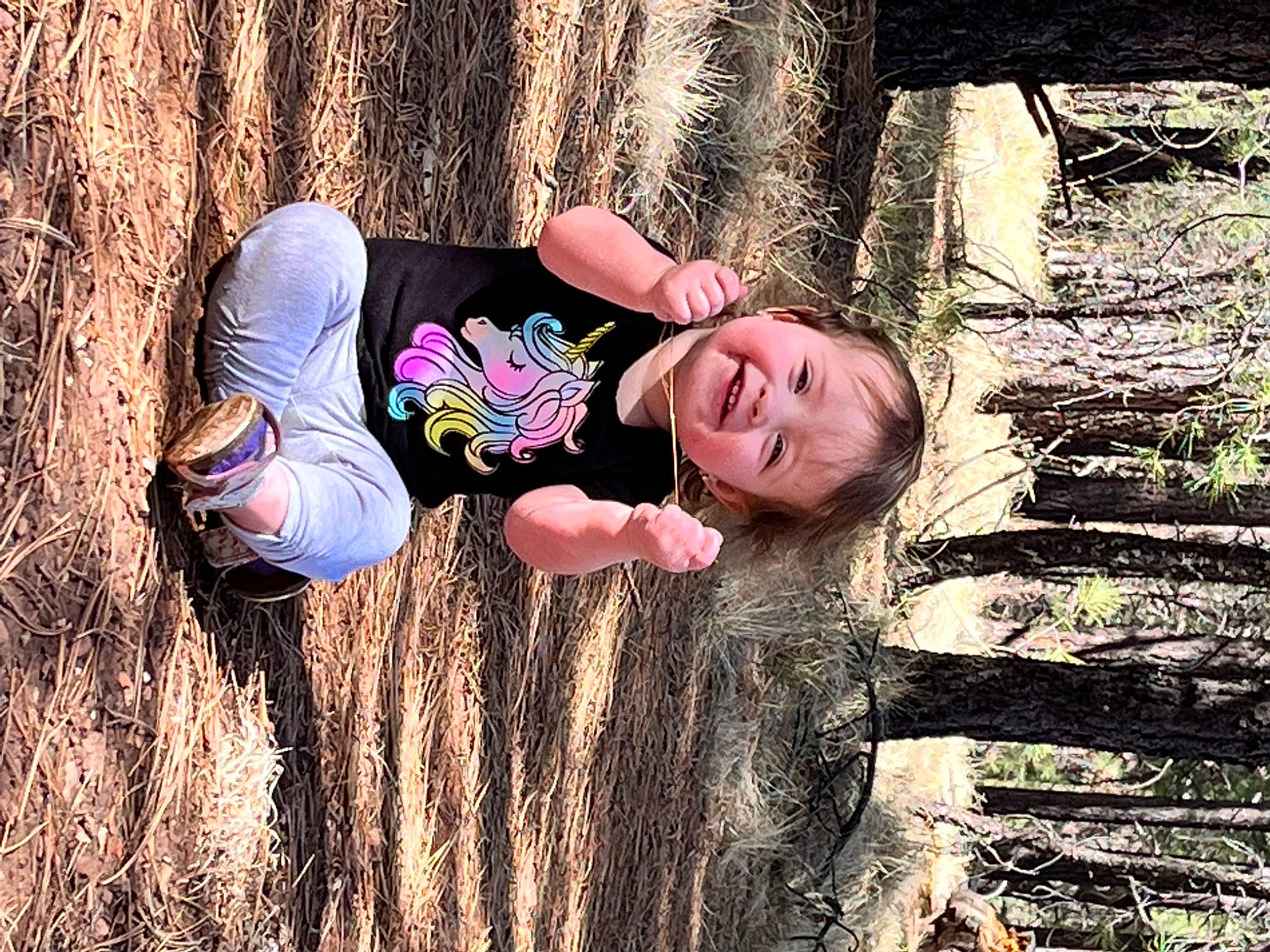 Rilynn is registered to the contest to win money with this photo: blond, branch, child, flash_photography, forest, fun, grass, happy, joy, leisure, people_in_nature, person, plant, sitting, skin, smile, spring, sunlight, tree, trunk