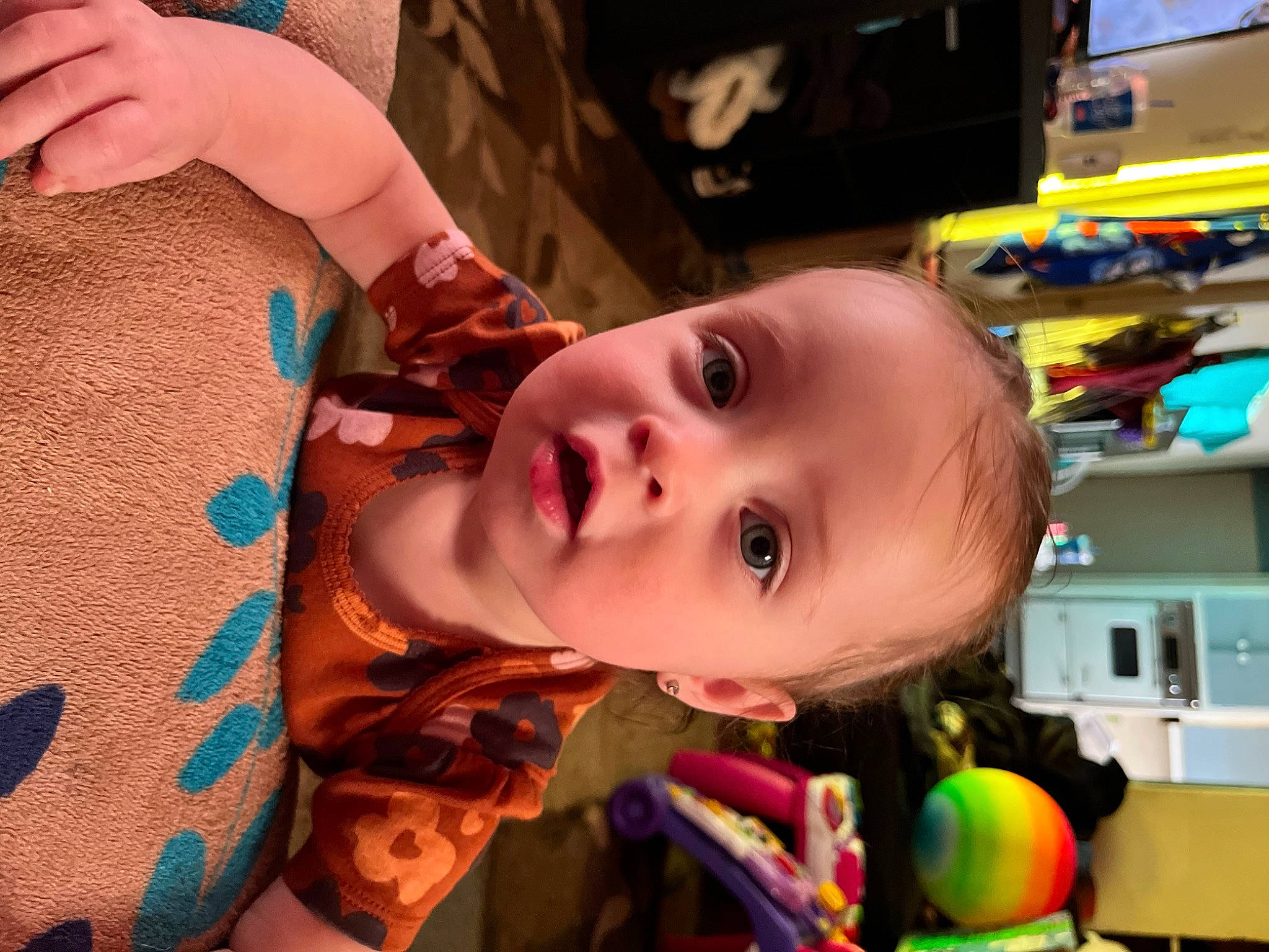 Rilynn is registered to the contest to win money with this photo: baby, beauty, cheek, child, chin, ear, eyelash, finger, fun, green, happy, iris, mouth, nose, organ, person, shelf, skin, smile, toddler