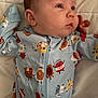baby, infant, onesie, pacifier, bed, sleepwear, cute, portrait, child, soft, fabric, blue, pattern, cartoon, food, laying, young, face, expression, clothing
