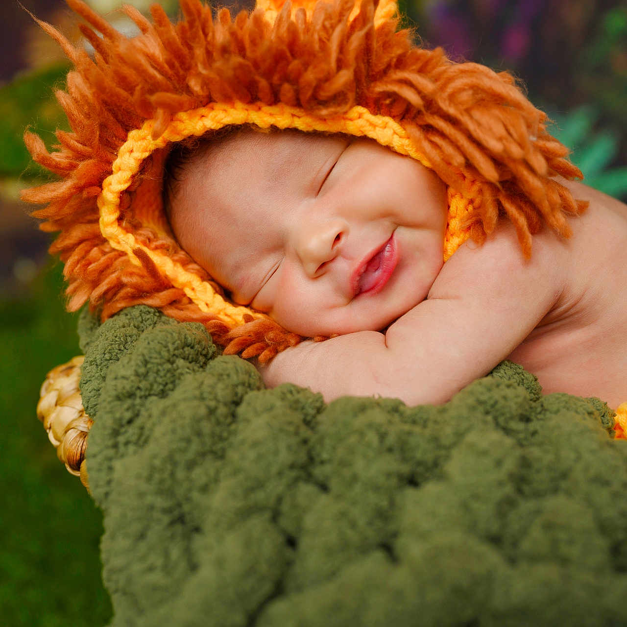 Alpha joined the competition — help win amazing prizes! adorable, baby, child, closeup, cozy, cute, green_blanket, infant, knitted_hat, lion_costume, nature, orange, outdoor, peaceful, portrait, resting, sleeping, smile, soft_texture, warm