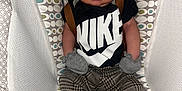 Alpha joined the competition — help win amazing prizes! baby, sleeping, nike, hat, mittens, pants, baby_seat, patterned_fabric, footwear, infant, clothing, cute, resting, indoor, person, newborn, child, fashion, comfortable, small