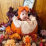Maycel joined the competition — help win amazing prizes! baby, pumpkin, headband, orange, flower, candle, fall, autumn, decor, leaf, wooden_background, smiling, infant, table, thanksgiving, holiday, cute, portrait, indoor, festive