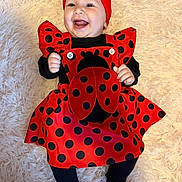 Maycel joined the competition — help win amazing prizes! baby, child, smiling, red_bow, ladybug_outfit, black_polka_dots, headband, happy, infant, cute, costume, lying_down, soft_rug, black_clothing, toddler, cheerful, portrait, indoor, adorable, fashion