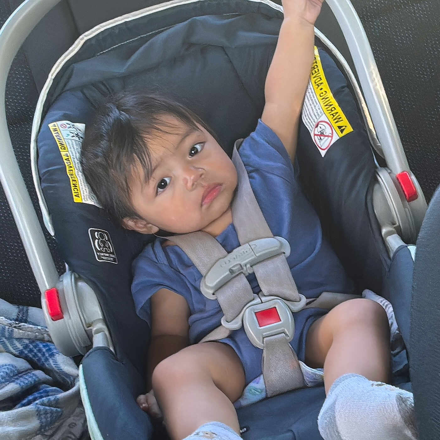 Ethan U Ortiz Ortiz joined the competition — help win amazing prizes! arm, baby, blanket, car_interior, car_seat, child, clothing, expression, face, footwear, hair, infant, person, rest, safety, seat, seatbelt, sitting, sock, transportation