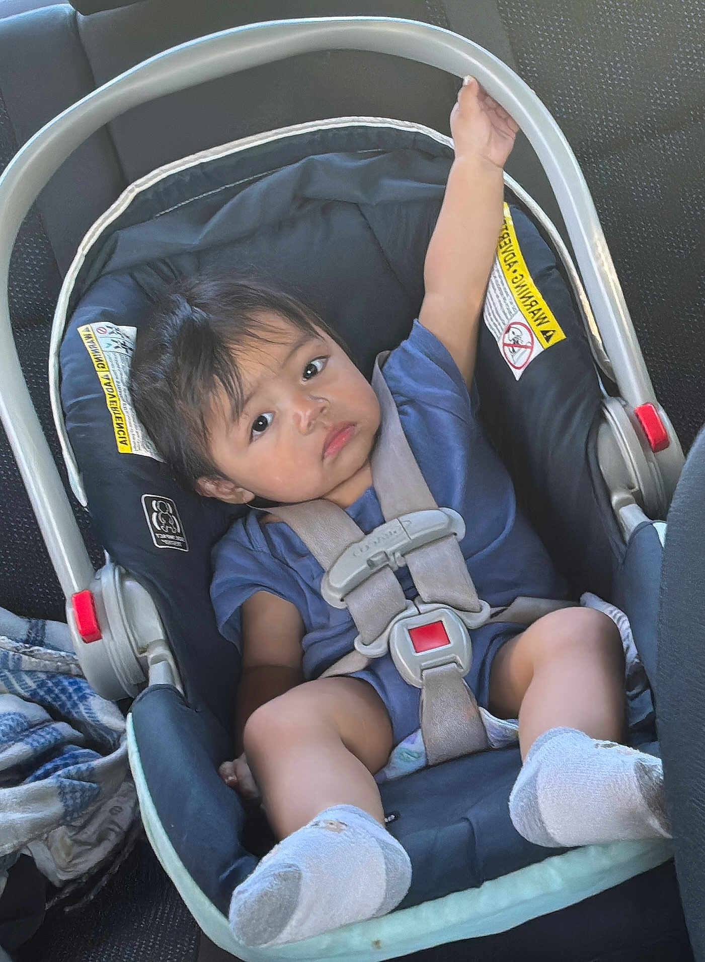 Ethan U Ortiz Ortiz joined the competition — help win amazing prizes! arm, baby, blanket, car_interior, car_seat, child, clothing, expression, face, footwear, hair, infant, person, rest, safety, seat, seatbelt, sitting, sock, transportation