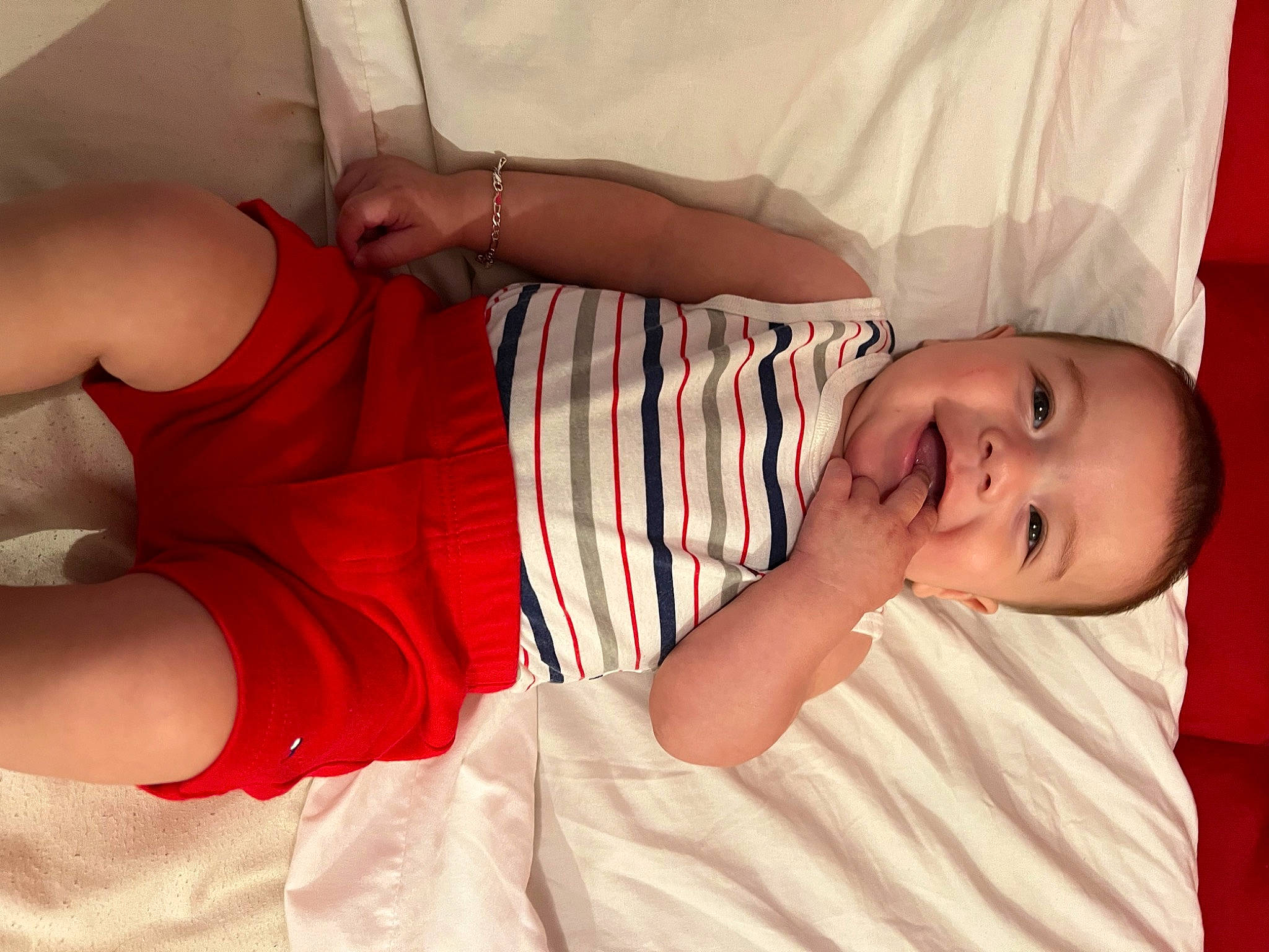 Liam is registered to the contest to win money with this photo: arm, chest, comfort, dress, elbow, finger, gesture, happy, human_body, joint, knee, lip, mouth, neck, person, skin, sleeve, stomach, textile, thigh