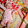 Blakely-Peach joined the competition — help win amazing prizes! baby, blanket, bow, child, colorful, dress, face, feet, hand, happy, indoor, infant, lying_down, patterned, photograph, pink_clothing, playtime, portrait, smiling, toy