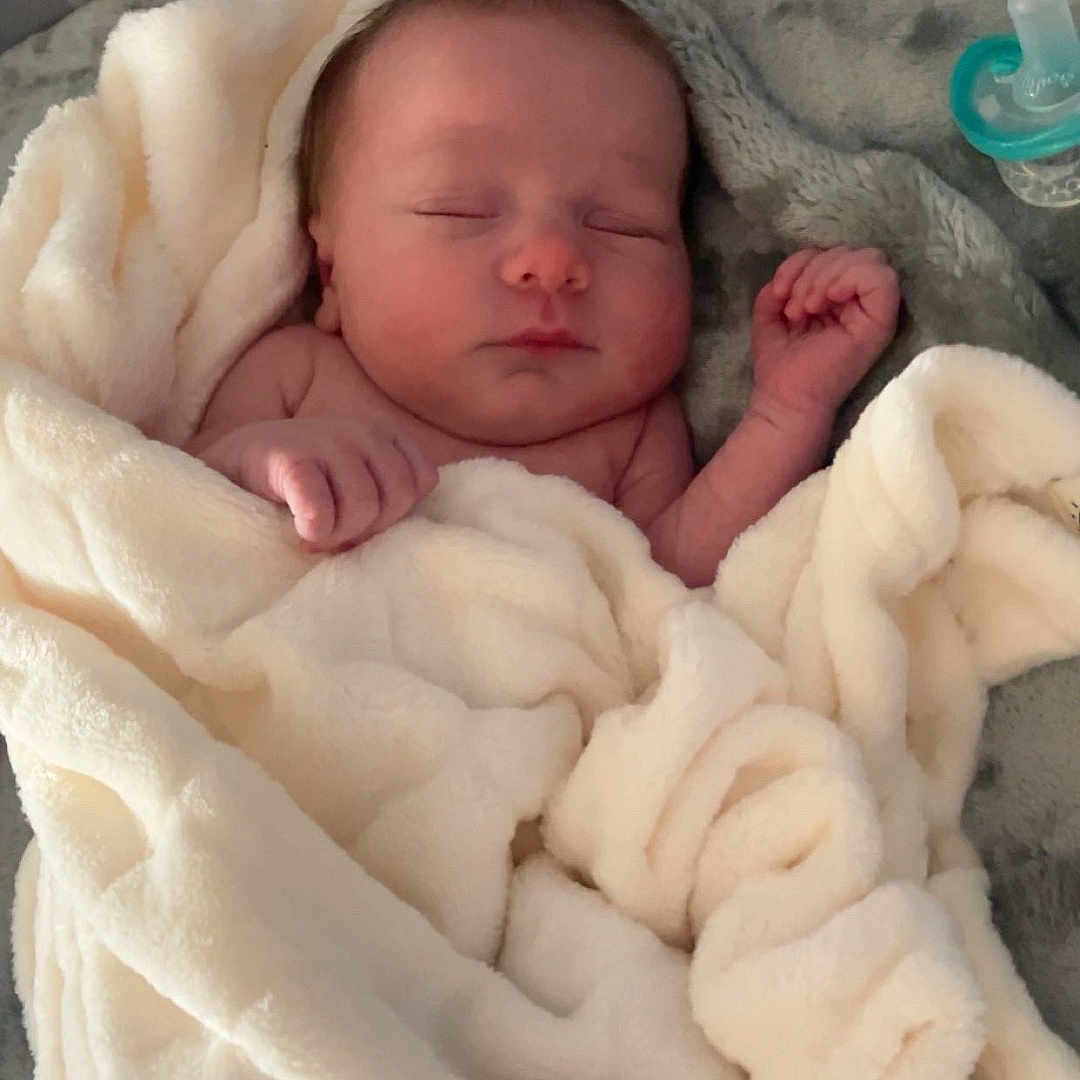 Tobias joined the competition — help win amazing prizes! baby, bed, bedroom, blanket, crib, cushion, face, furniture, head, homedecor, indoors, infantbed, newborn, person, photography, portrait, quilt, room, sleeping, towel