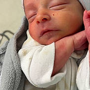 Crue joined the competition — help win amazing prizes! newborn, baby, sleeping, face, hand, blanket, clothing, cap, infant, cozy, closeup, soft, cute, peaceful, portrait, wrapped, resting, indoors, skin, young