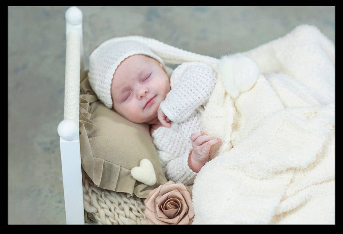 Maizie is registered to the contest to win money with this photo: baby, baby_products, baby_safety, baby_sleeping, baby_toddler_clothing, cheek, child, comfort, happy, hat, headwear, linens, pattern, person, pink, portrait_photography, room, rose, rose_family, rose_order