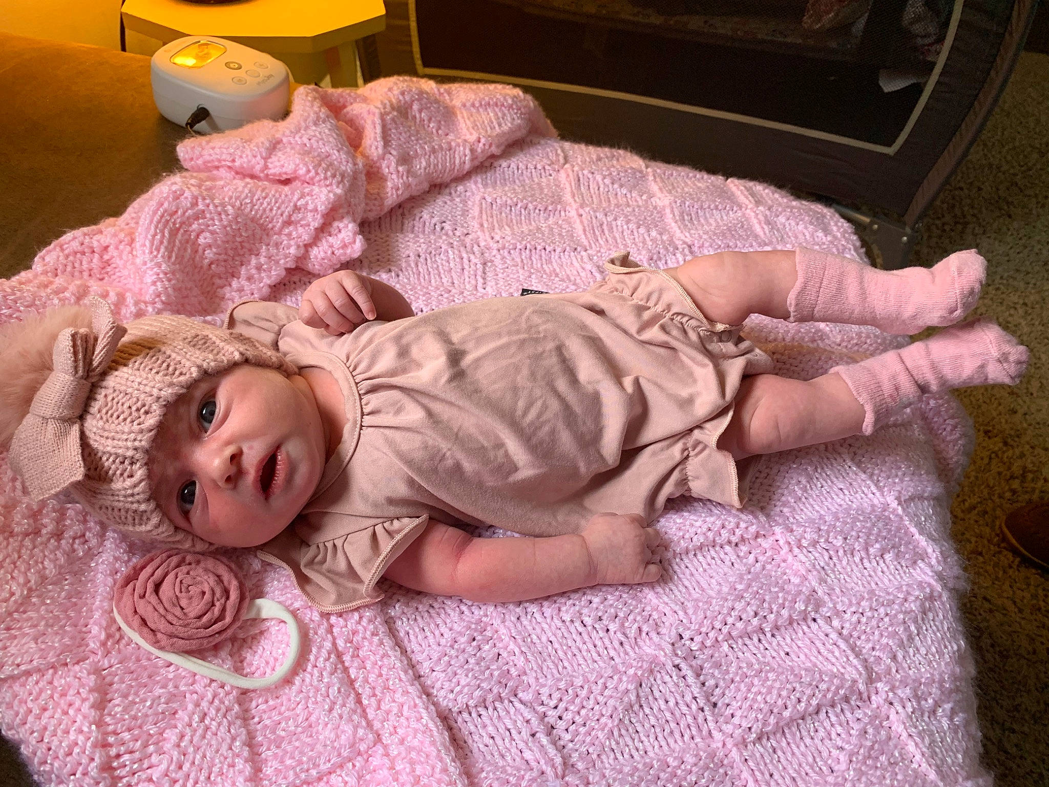 Maizie joined the competition — help win amazing prizes! arm, baby, baby_toddler_clothing, bedding, bedtime, cheek, comfort, eye, face, finger, flooring, hand, head, headwear, human_body, linens, mouth, person, pink, skin