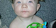 Sebastian joined the competition — help win amazing prizes! baby, child, diaper, toy, frog_toy, drool, blue_eyes, couch, cushion, indoor, infant, person, skin, hand, face, curious, seated, soft_fabric, plush, cute
