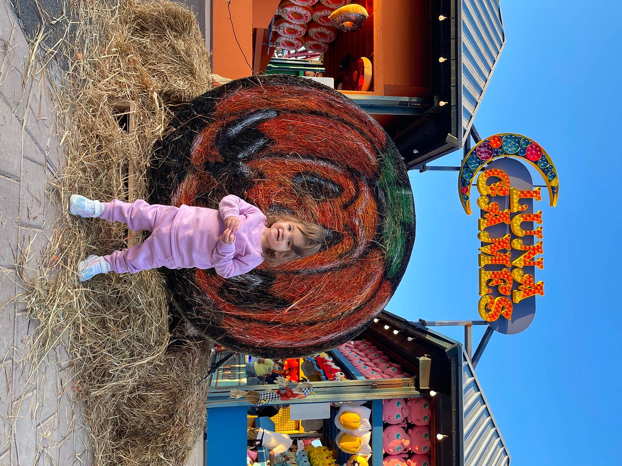 Leandra is registered to the contest to win money with this photo: art, event, festival, fun, hat, joy, people, person, pole, public_event, signaling_device, sky, street_light, transport