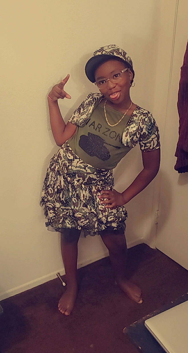 Trinity joined the competition — help win amazing prizes! dress, headgear, joy, leg, person, sitting