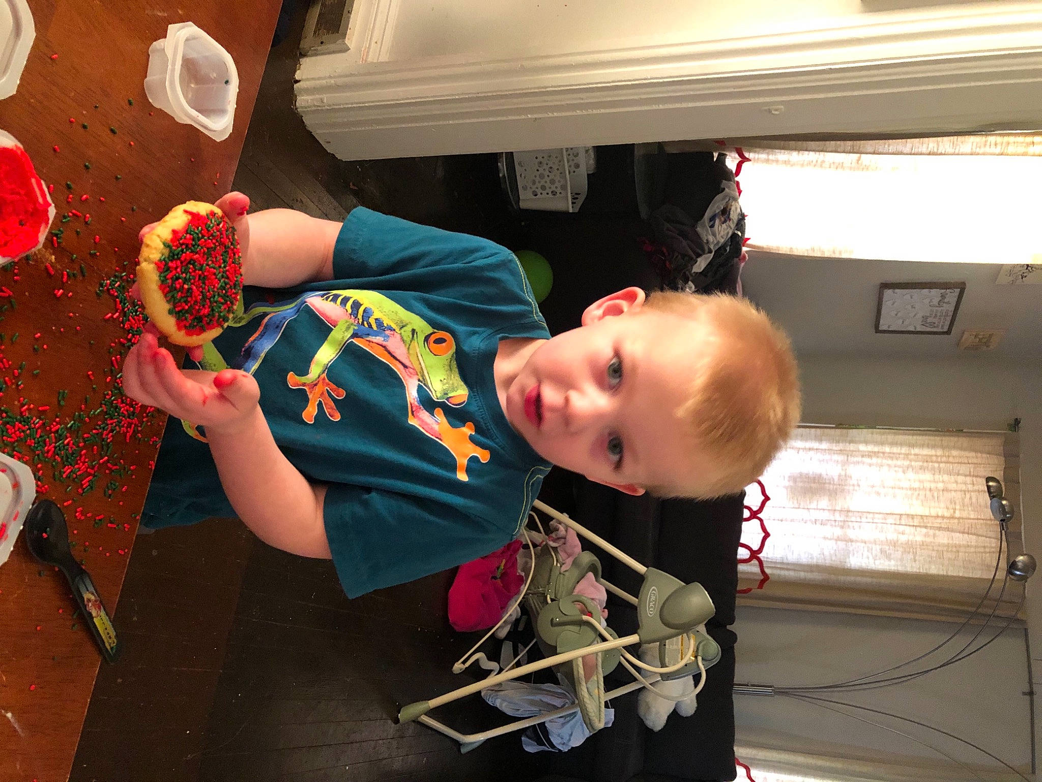 Malachi is registered to the contest to win money with this photo: baby, baby_toddler_clothing, dessert, kitchen_utensil, person, plate, platter, play, tableware