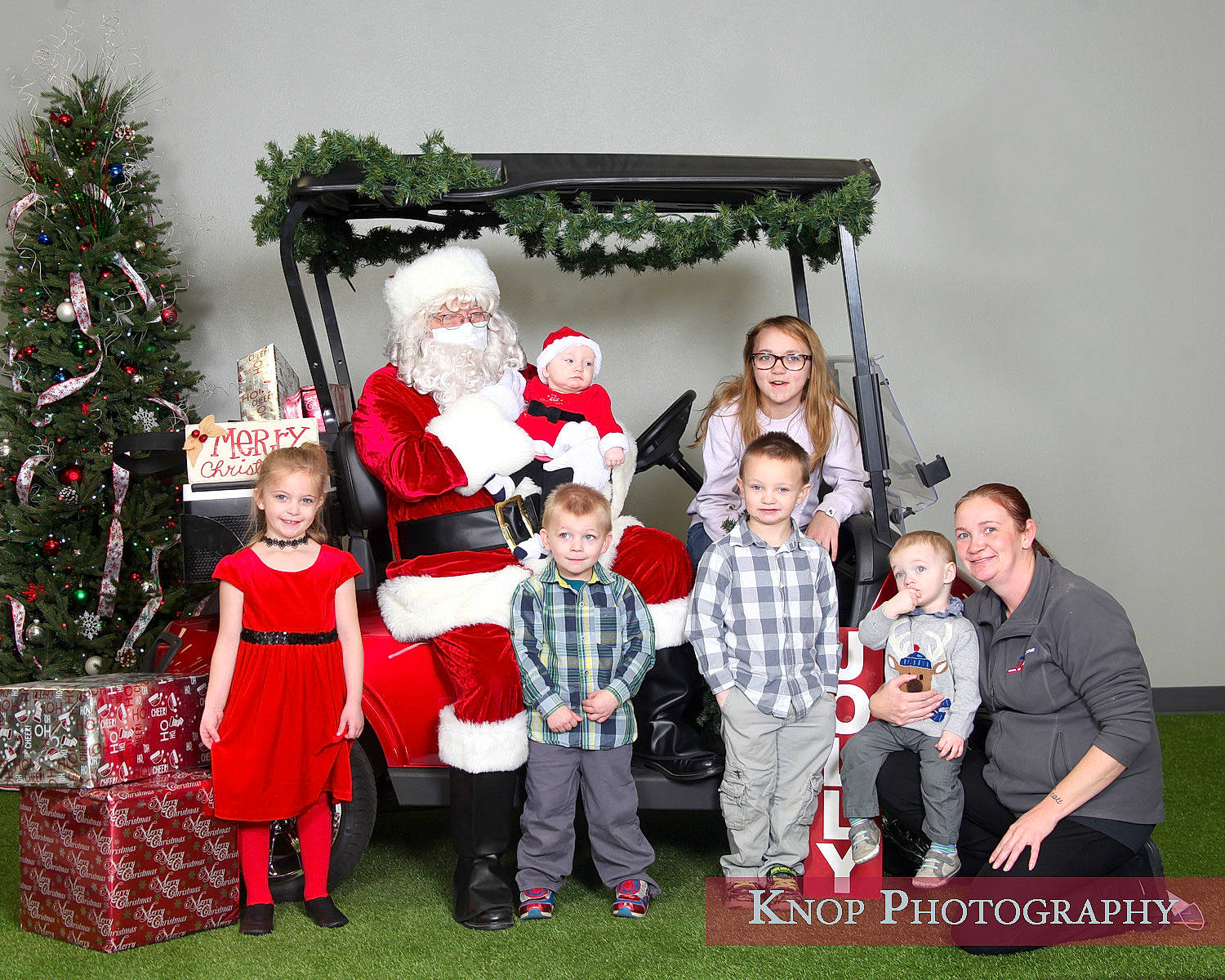 Leland joined the competition — help win amazing prizes! boot, christmas, christmas_decoration, christmas_eve, christmas_ornament, christmas_tree, conifer, costume_accessory, evergreen, family, fictional_character, holiday, holiday_ornament, human, interior_design, joy, lap, ornament, person, pine_family