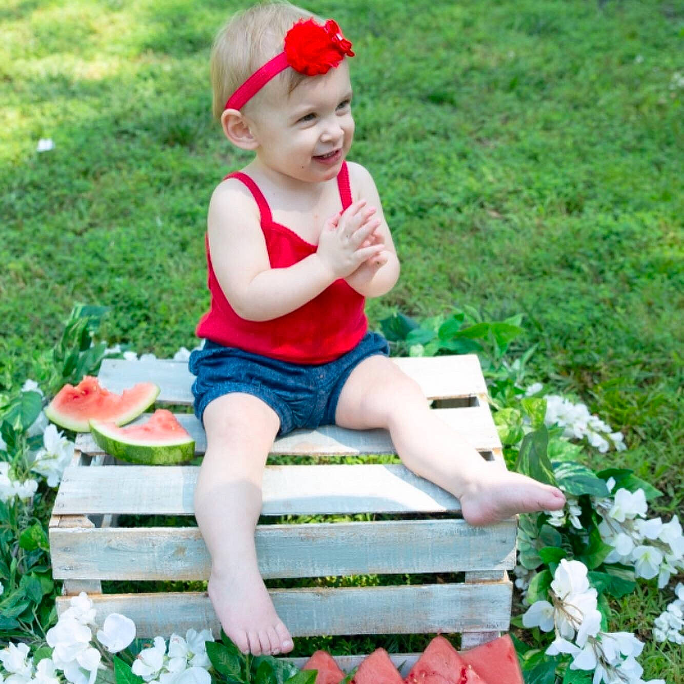 Arizona joined the competition — help win amazing prizes! baby, baby_toddler_clothing, botany, child, child_model, fashion_accessory, flower, grass, happy, headgear, leg, person, petal, plant, play, red, sitting, smile, spring, summer