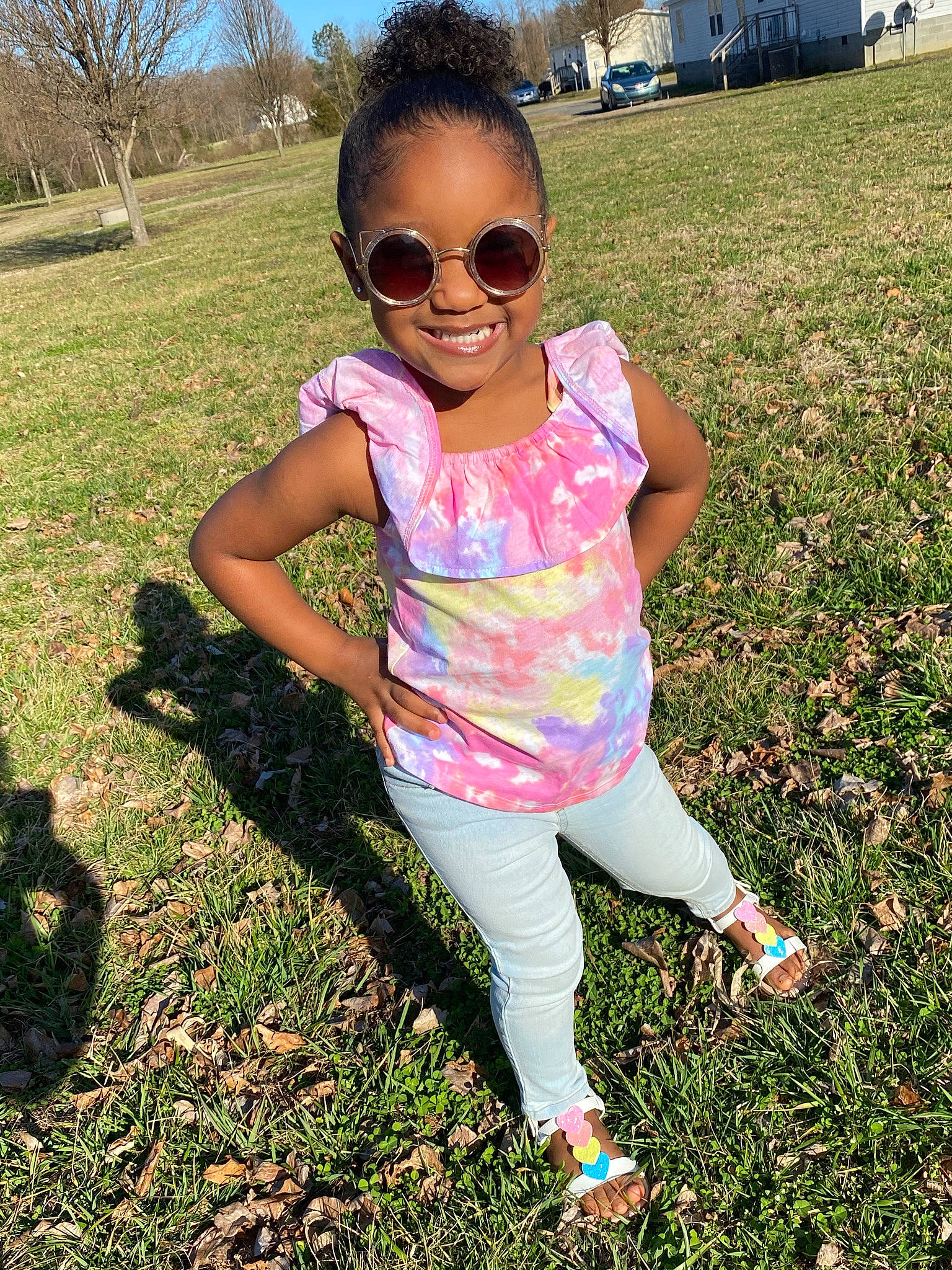 Amirah is registered to the contest to win money with this photo: cool, eyewear, fun, goggles, grass, happy, head, joy, leaf, light, people_in_nature, person, pink, plant, shoe, sky, sleeve, smile, sunglasses, sunlight