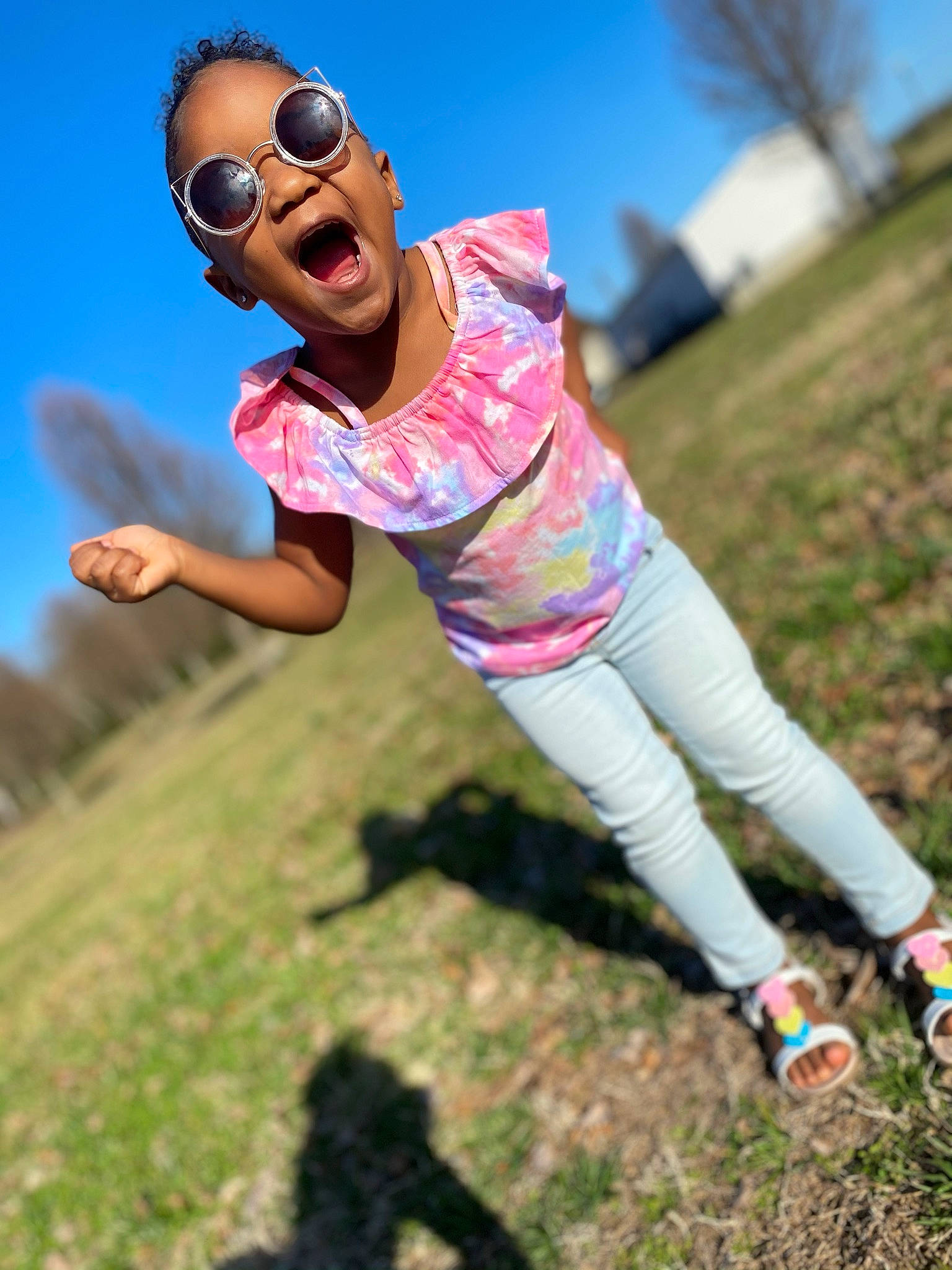 Amirah is registered to the contest to win money with this photo: adventure, eyewear, fun, gesture, goggles, grass, grassland, happy, landscape, leisure, meadow, people_in_nature, person, plant, recreation, sky, smile, sunglasses, travel, tree