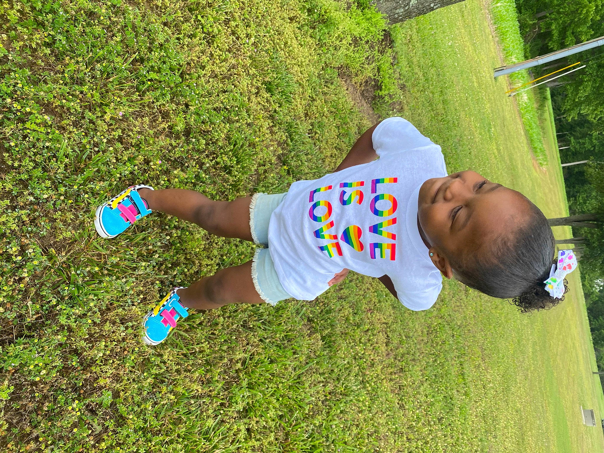 Amirah joined the competition — help win amazing prizes! baby, baby_toddler_clothing, child, electric_blue, fun, grass, grass_family, grassland, happy, joy, lawn, leisure, people_in_nature, person, plant, play, recreation, shorts, soil, t_shirt