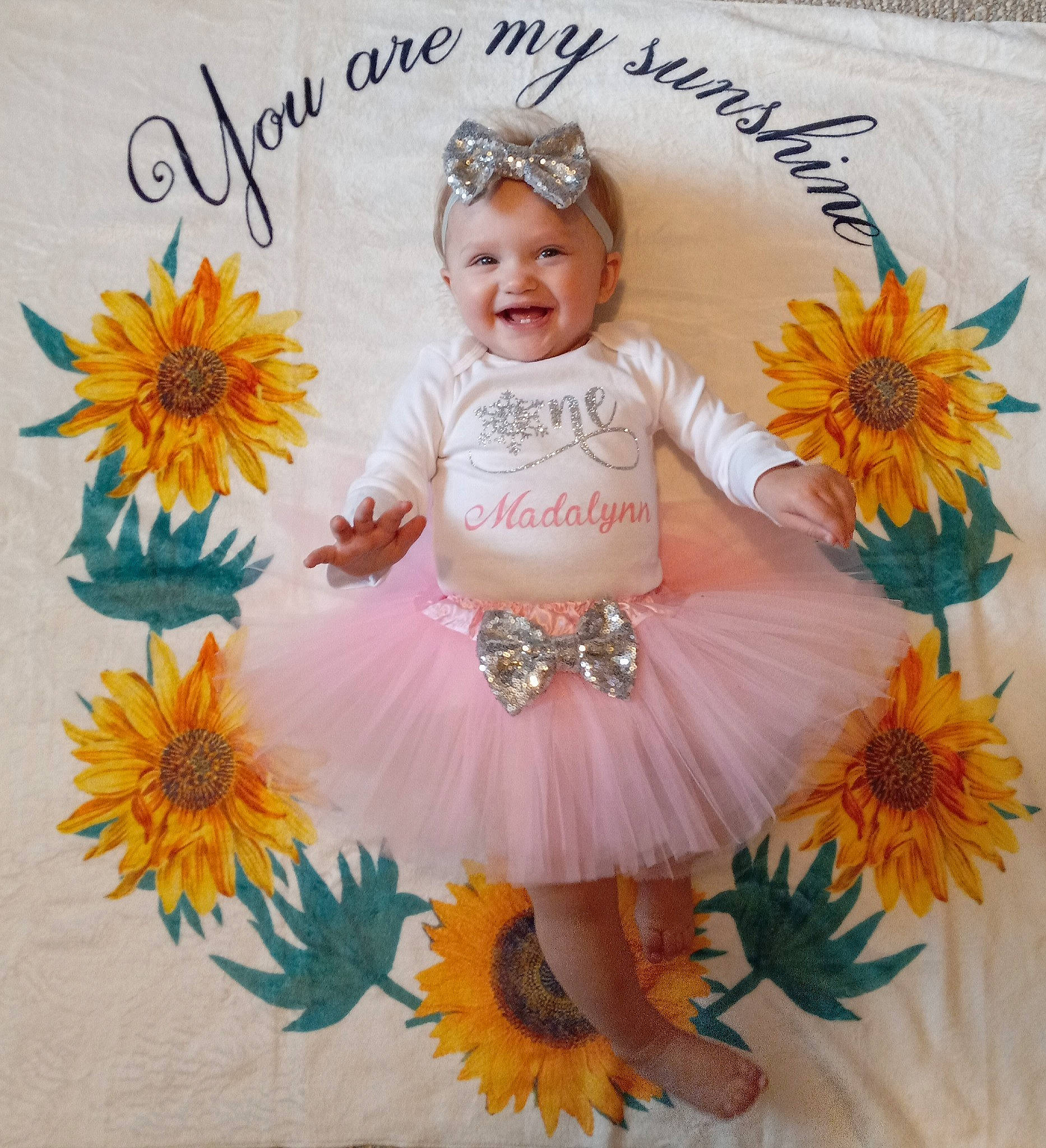 Madalynn joined the competition — help win amazing prizes! baby, baby_toddler_clothing, child, cut_flowers, floral_design, flower, flowering_plant, font, happy, headpiece, headwear, illustration, joy, pattern, person, petal, plant, product, smile, spring
