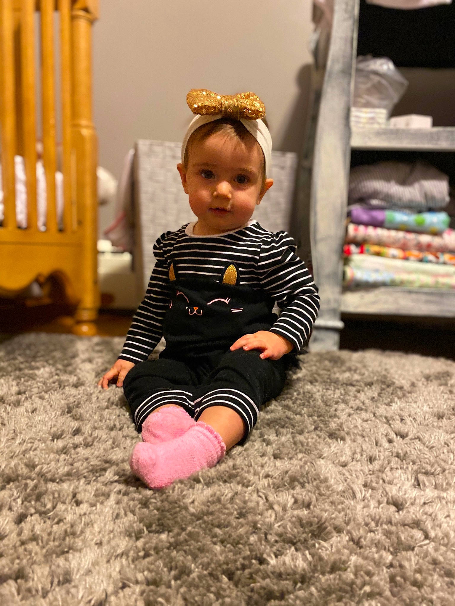 Carter joined the competition — help win amazing prizes! baby, baby_products, baby_toddler_clothing, carpet, child, child_model, foot, hair_accessory, headband, headpiece, human_body, linens, mouth, nose, nursery, person, play, shelf, shelving, tiara