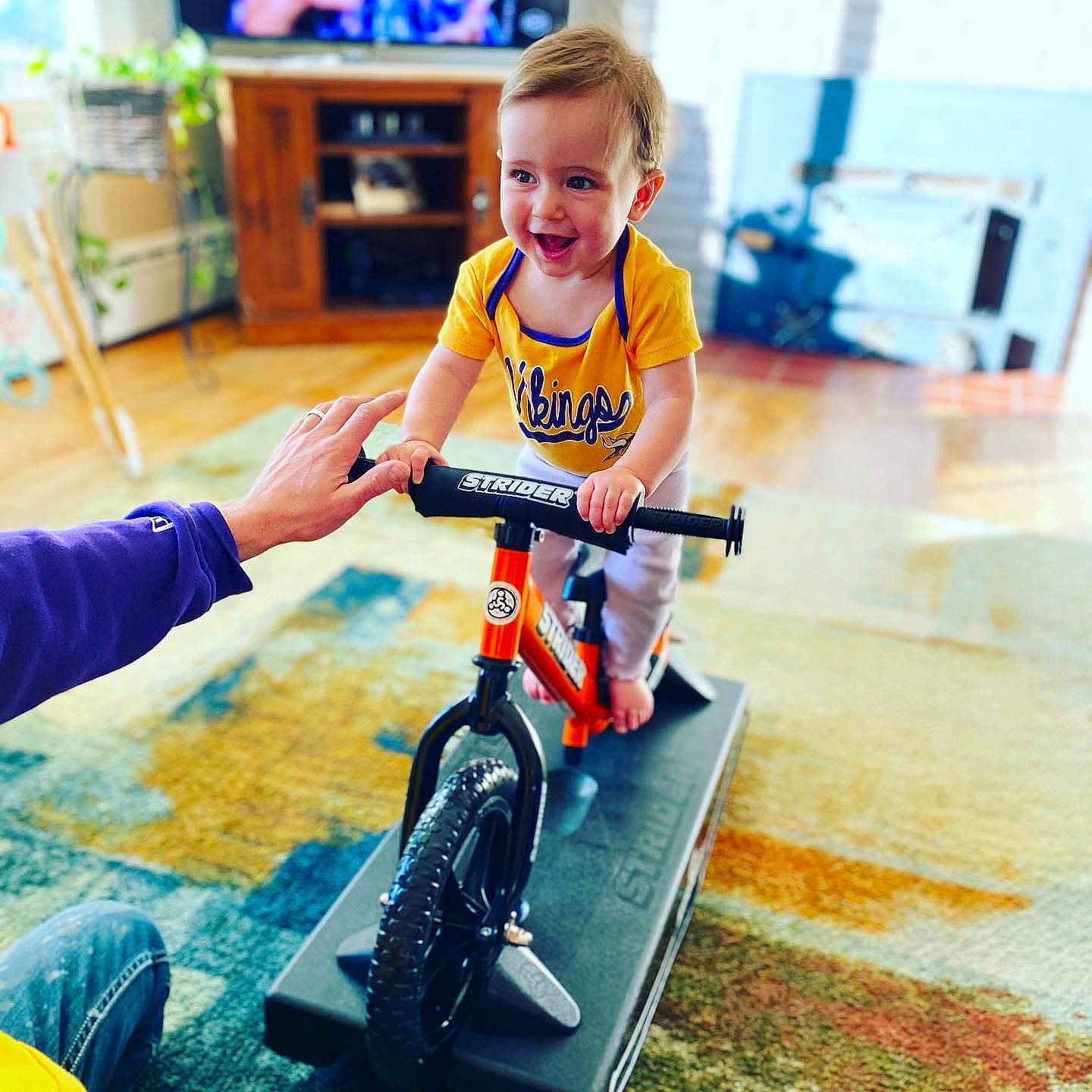 Carter joined the competition — help win amazing prizes! baby, baby_toddler_clothing, bicycle, bicycle_accessory, bicycle_fork, bicycle_frame, bicycle_handlebar, bicycle_part, bicycle_tire, bicycle_wheel, bicycle_wheel_rim, bicycles_equipment_and_supplies, cycling, houseplant, person, play, shelf, spoke, tire, toddler