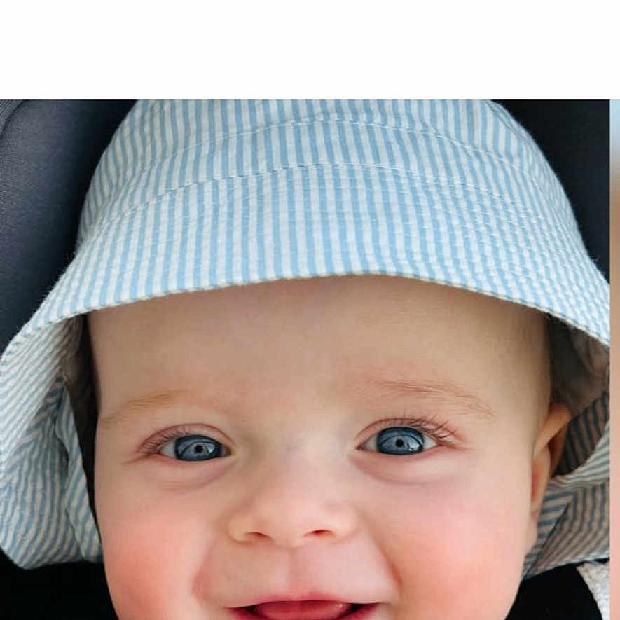 Marceau a rejoint le concours — aidez-le/la à gagner de superbes lots ! baby, child, face, smiling, hat, blue_eyes, close_up, portrait, cute, infant, headwear, happy, cheeks, skin, person, clothing, seatbelt, car_seat, baby_face, young_child