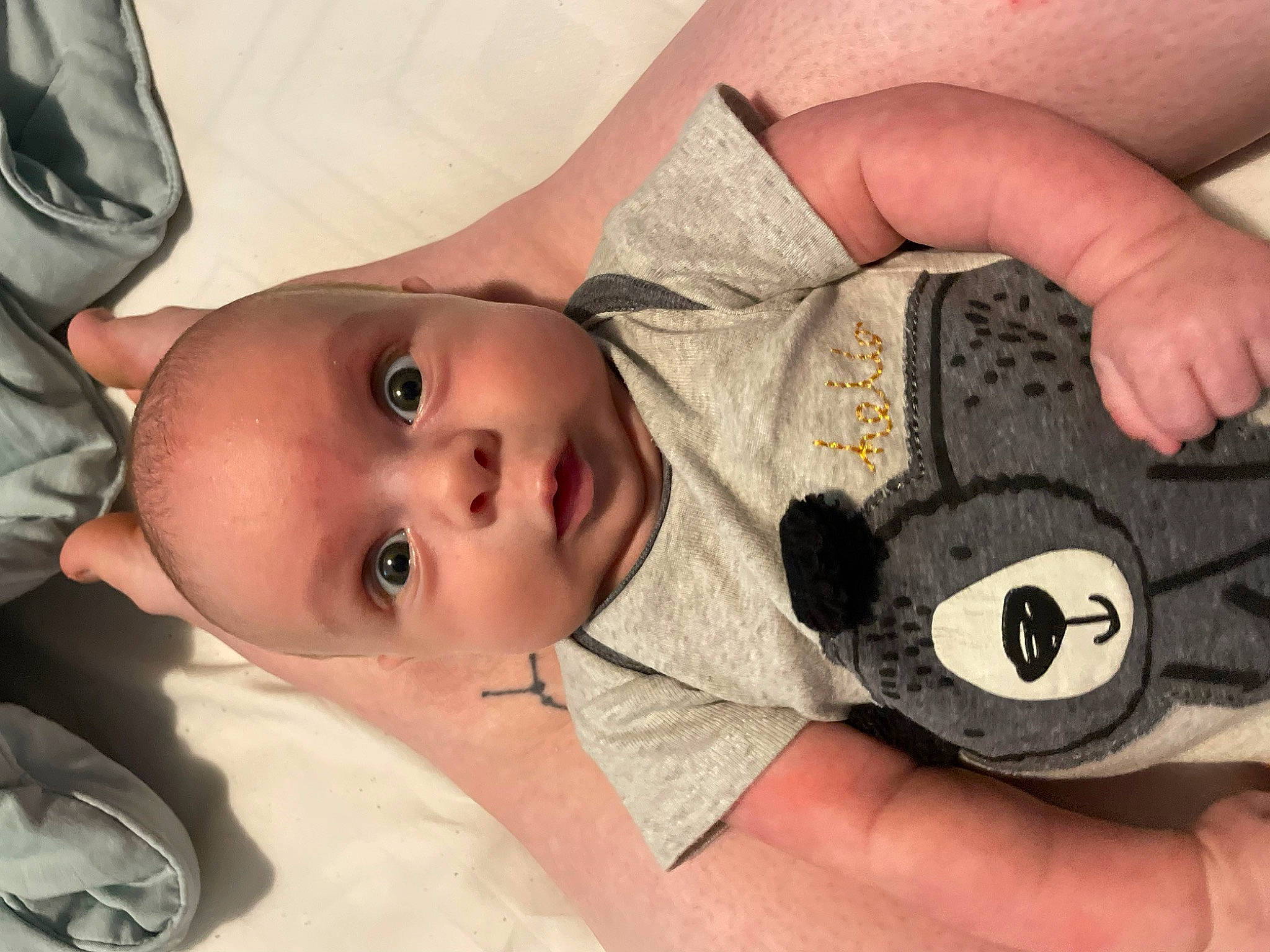 Felix is registered to the contest to win money with this photo: baby, baby_toddler_clothing, cheek, chin, eye, facial_expression, finger, gesture, hairstyle, hand, head, headgear, iris, lip, mouth, nose, person, product, skin, textile