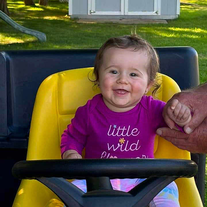 Aryela is registered to the contest to win money with this photo: baby, backyard, clothing, face, grass, head, lawn, nature, outdoors, park, person, photography, plant, playarea, portrait, summer, t_shirt, transportation, tree, yard
