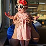 Leonora joined the competition — help win amazing prizes! baby, child, pink_dress, flower_headband, sunglasses, adult_hands, person, indoor, window, table, reflection, seat, public_transport, sign, sunlight, shadow, beard, casual_clothing, foot, expression