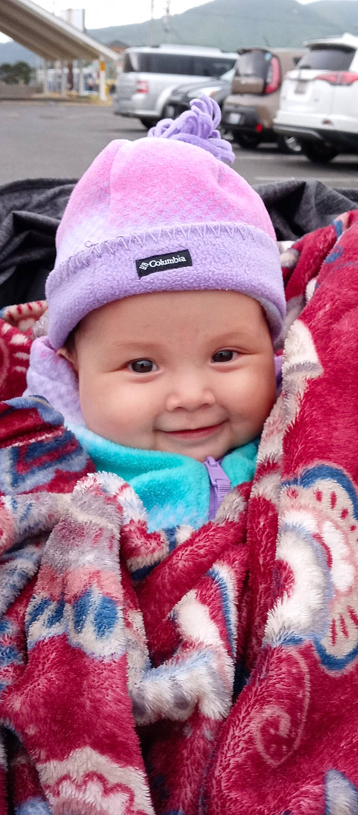 Kyleah is registered to the contest to win money with this photo: baby, baby_toddler_clothing, cap, cheek, child, chin, eye, face, facial_expression, happy, headgear, headwear, iris, jacket, joy, lip, nose, organ, person, pink