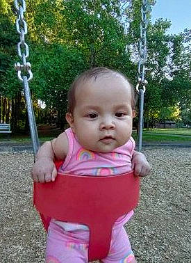 Kyleah joined the competition — help win amazing prizes! baby, baby_toddler_clothing, beauty, cheek, eye, fun, grass, hand, happy, head, leisure, people_in_nature, person, pink, plant, playground, sleeve, standing, swing, toddler