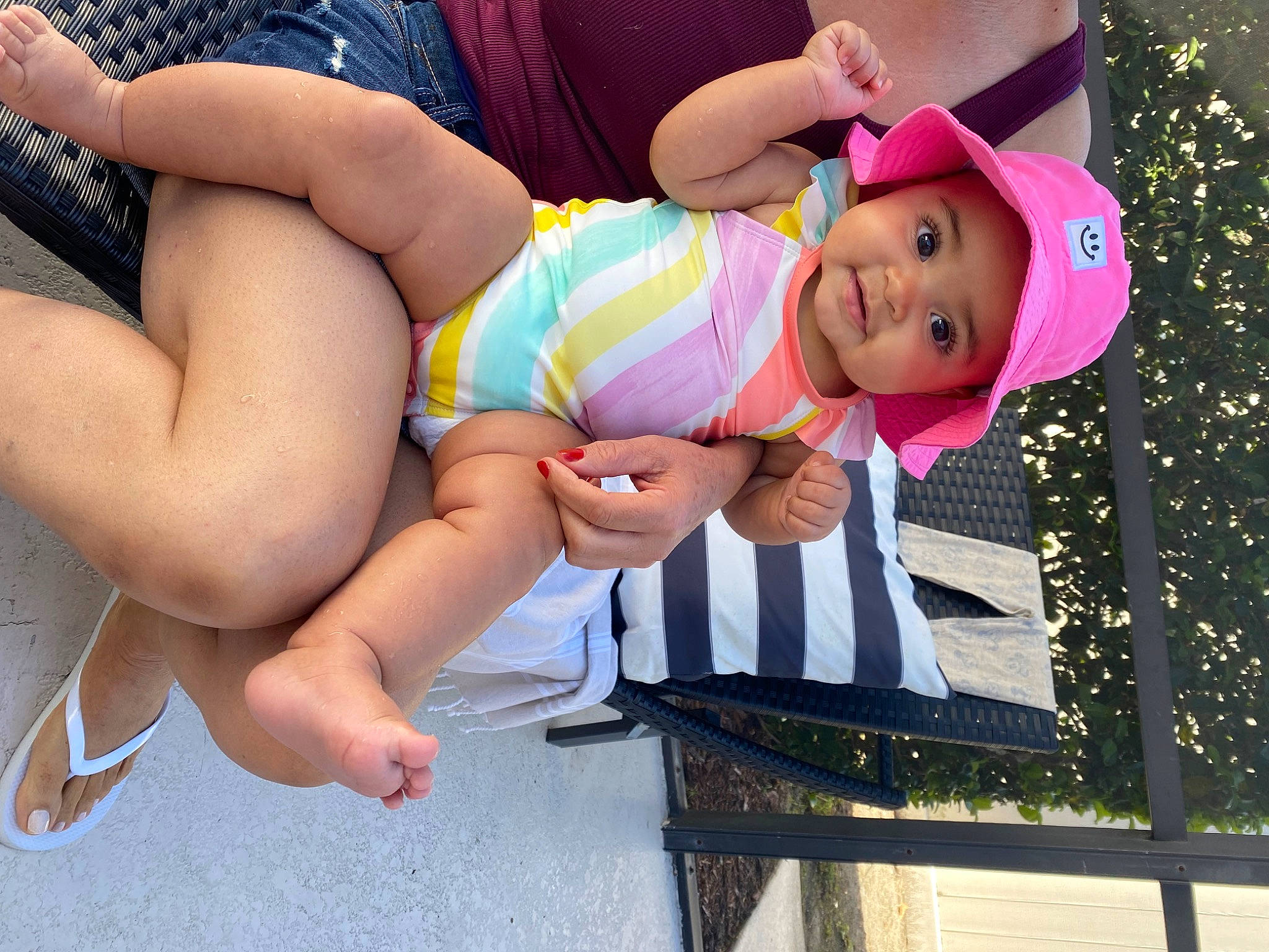 Gabriella is registered to the contest to win money with this photo: baby, baby_toddler_clothing, barefoot, chest, child, event, foot, fun, happy, headwear, human_leg, knee, leisure, magenta, pattern, person, photograph, pink, shorts, smile
