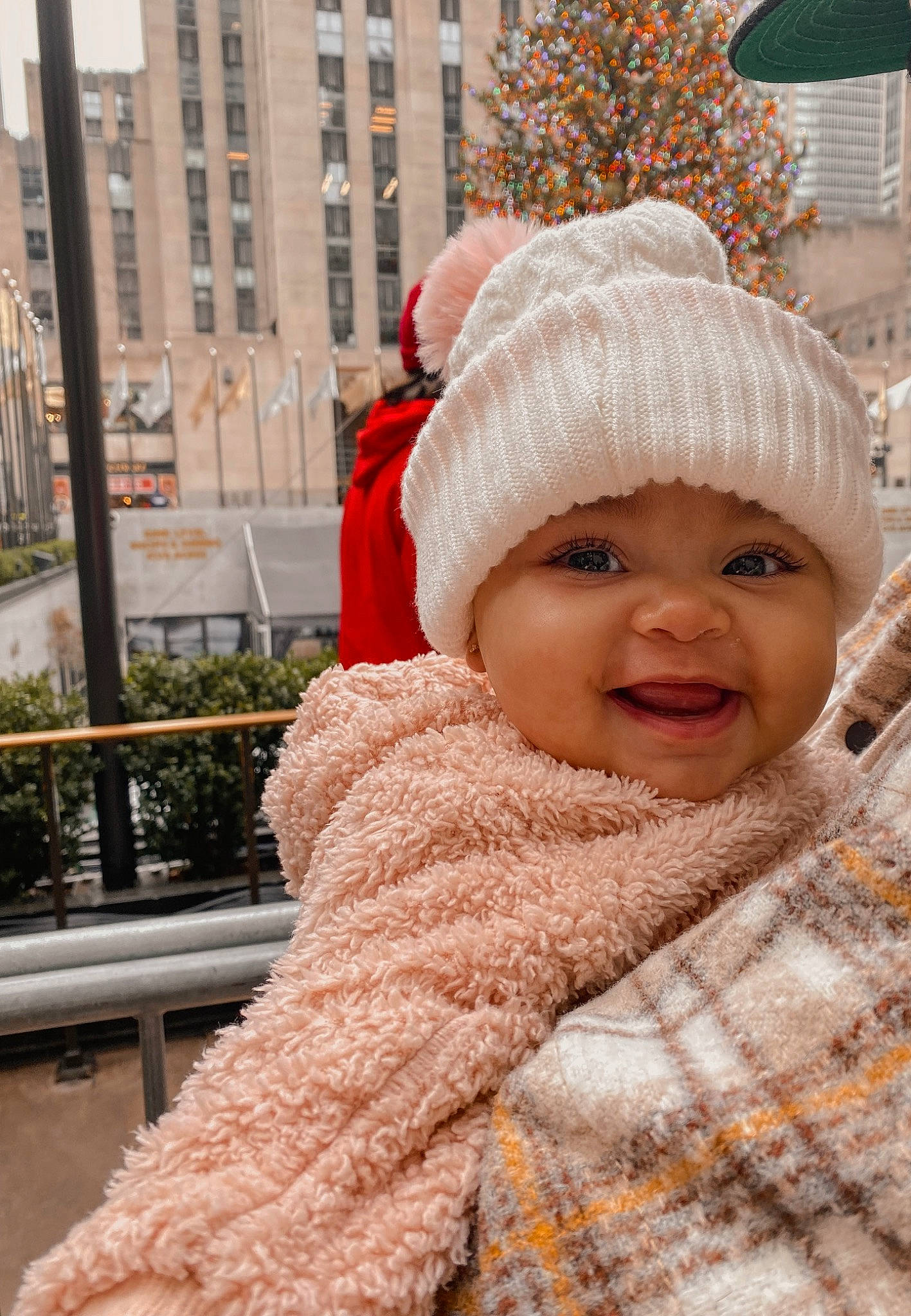 Gabriella joined the competition — help win amazing prizes! cap, event, eye, face, freezing, fun, fur, fur_clothing, happy, headgear, headwear, human_body, jacket, knit_cap, person, plant, skin, smile, toddler, tree