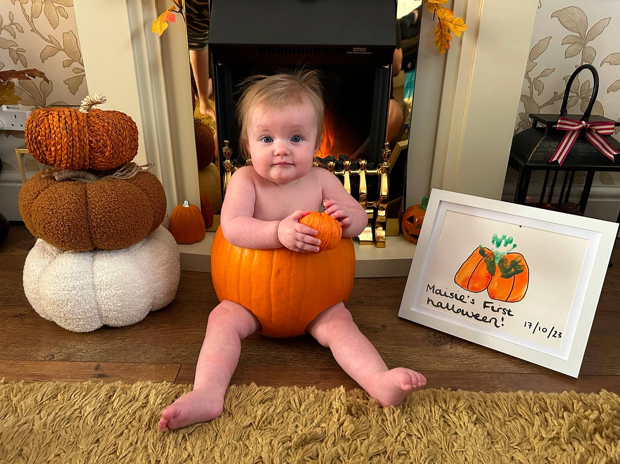 Maisie joined the competition — help win amazing prizes! baby, calabaza, child, cucurbita, flooring, fun, gourd, living_room, natural_foods, orange, people, person, plant, product, pumpkin, squash, textile, toddler, vegetable, winter_squash
