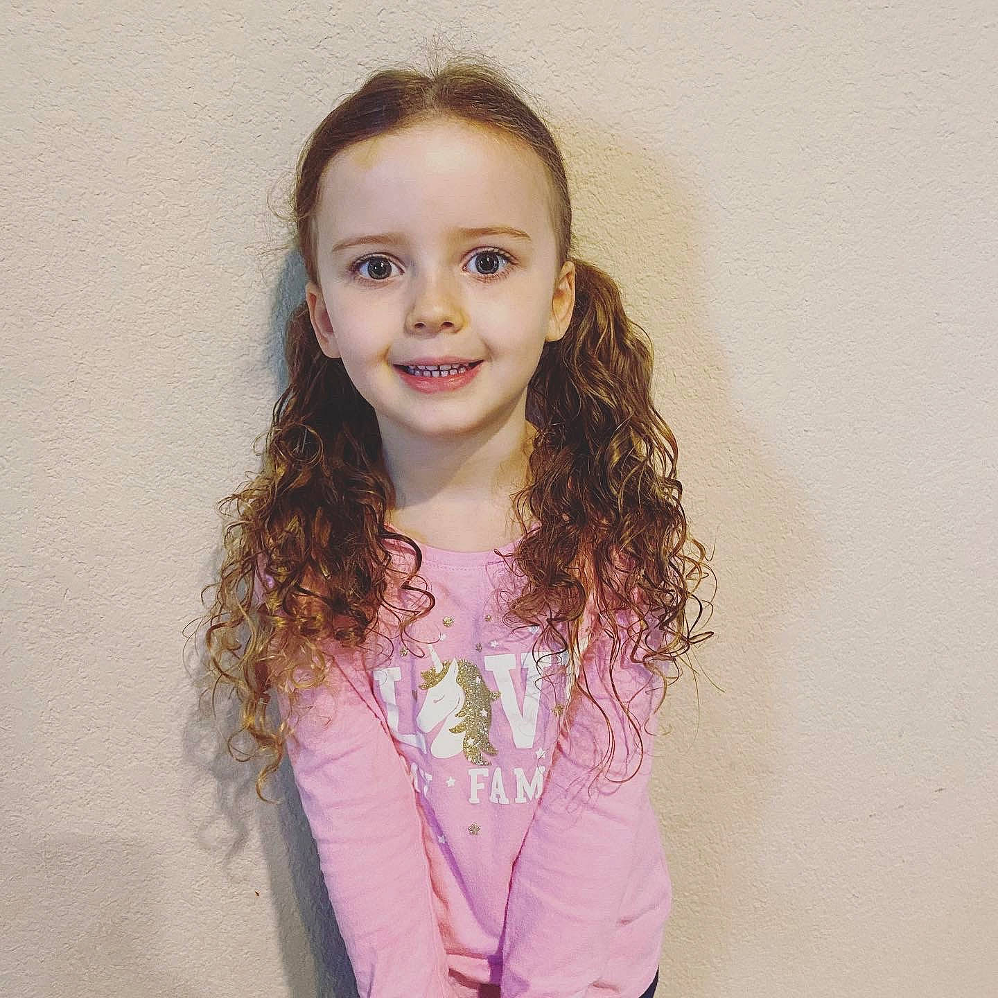 Amelia joined the competition — help win amazing prizes! blond, cheek, eyelash, face, fashion_design, flash_photography, gesture, happy, iris, joy, lip, long_hair, magenta, neck, person, skin, sleeve, smile, standing, t_shirt