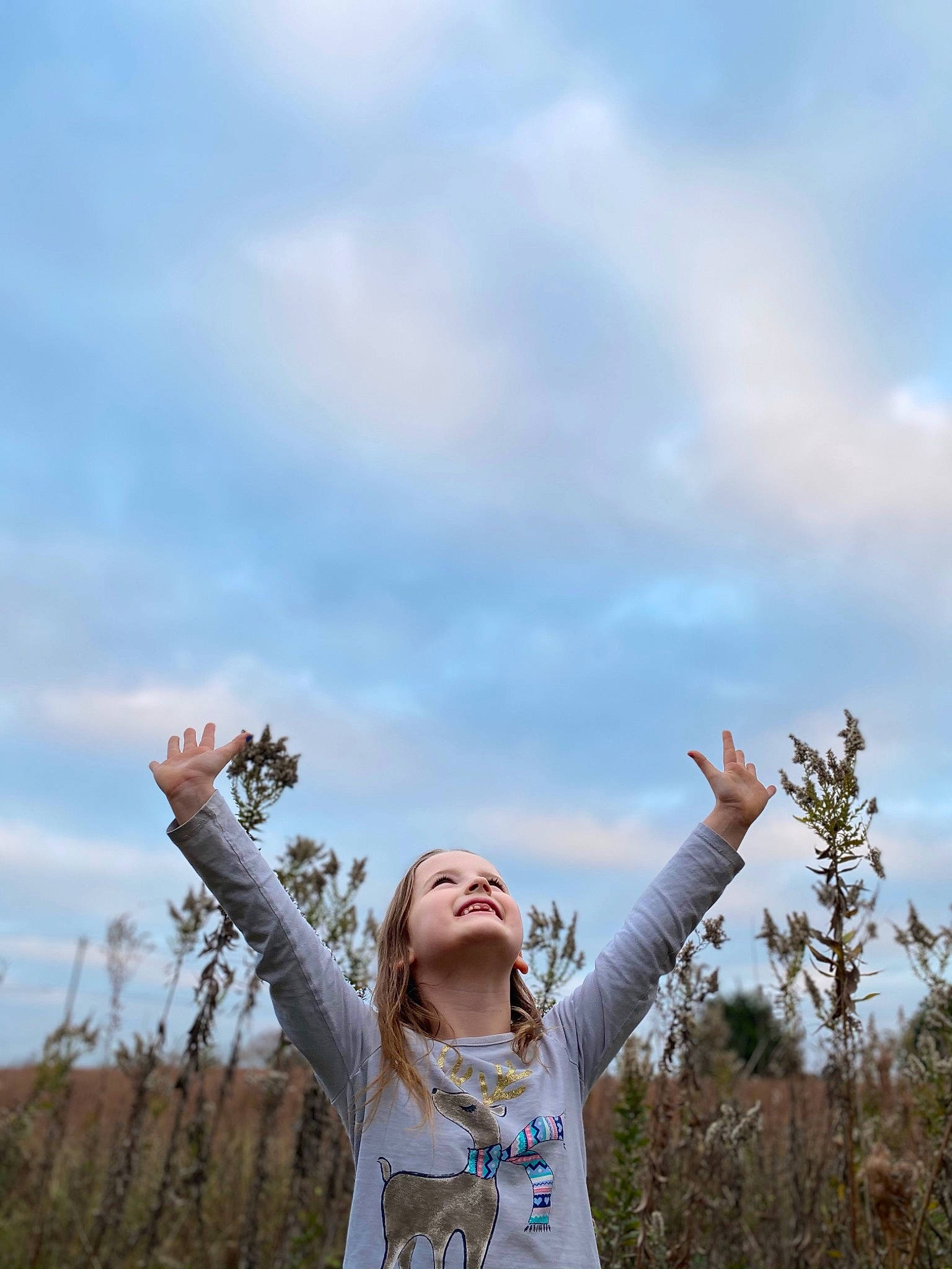 Elliott joined the competition — help win amazing prizes! child, cloud, cumulus, field, flash_photography, fun, gesture, grass, grassland, happy, joy, landscape, leisure, meadow, natural_landscape, people_in_nature, person, prairie, sky, t_shirt