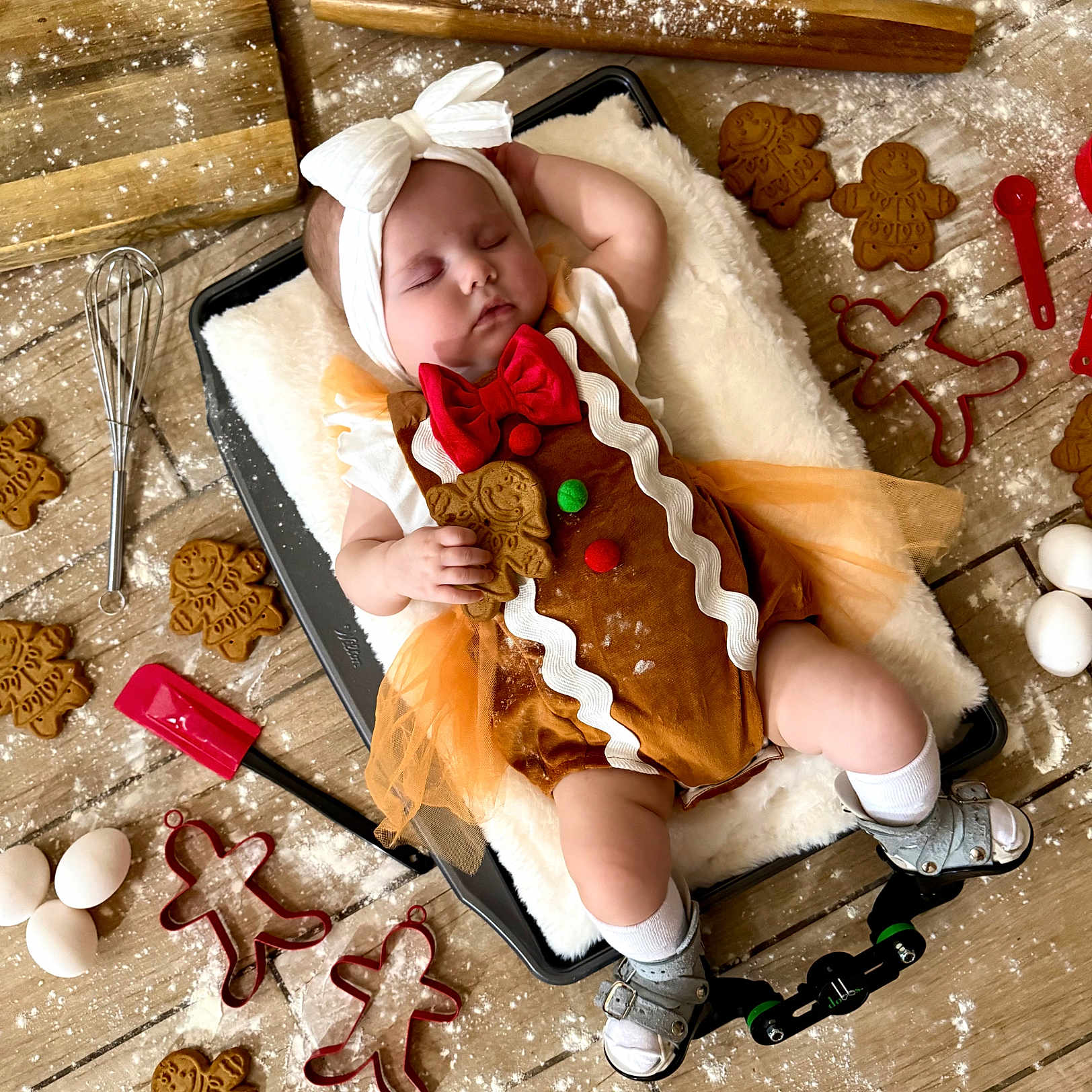 Kaisyn is registered to the contest to win money with this photo: baby, baking, baking_tray, cookie_cutters, cute, eggs, flour, gingerbread_cookies, gingerbread_costume, headband, holiday_theme, infant, kitchen, sandals, sleeping, socks, spatula, tulle_skirt, whisk, wooden_floor