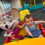 Giovani joined the competition — help win amazing prizes! amusement, cartoon_character, child, childhood, colorful, cute, entertainment, fun, happy, indoor, kiddie_ride, mouse, overalls, play_area, seat, short_sleeve_shirt, smiling, toddler, toy_car, young_child