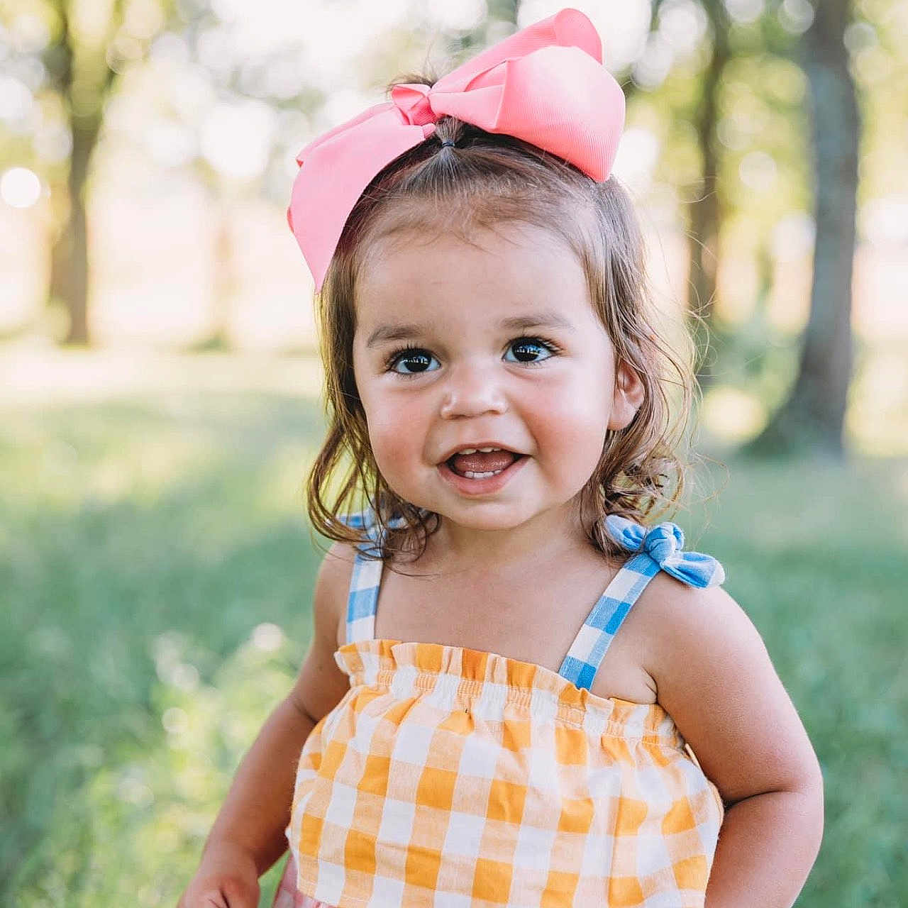 Wrenlee is registered to the contest to win money with this photo: baby, babylaughing, child, clothing, dress, face, female, girl, grass, happy, hat, head, laughing, outdoors, person, photography, plant, portrait, smile, tree
