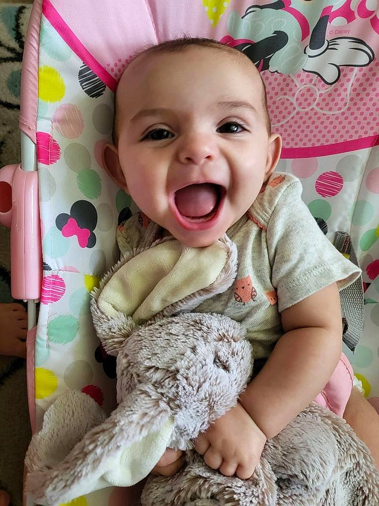 Novalie joined the competition — help win amazing prizes! baby, baby_laughing, baby_toddler_clothing, cheek, child, comfort, eye, face, happy, head, iris, linens, pattern, person, pink, skin, sleeve, smile, t_shirt, textile