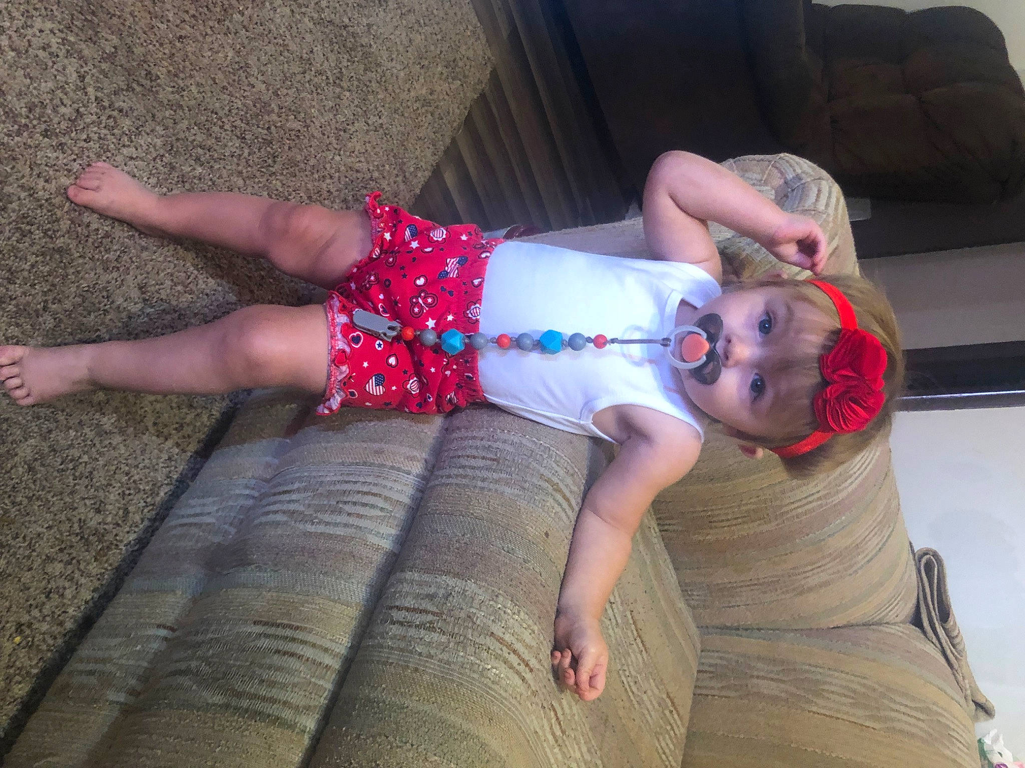 Opal is registered to the contest to win money with this photo: baby, baby_toddler_clothing, child, comfort, elbow, finger, foot, fun, hat, human_body, human_leg, joint, knee, lap, leg, pattern, person, textile, thigh, toddler