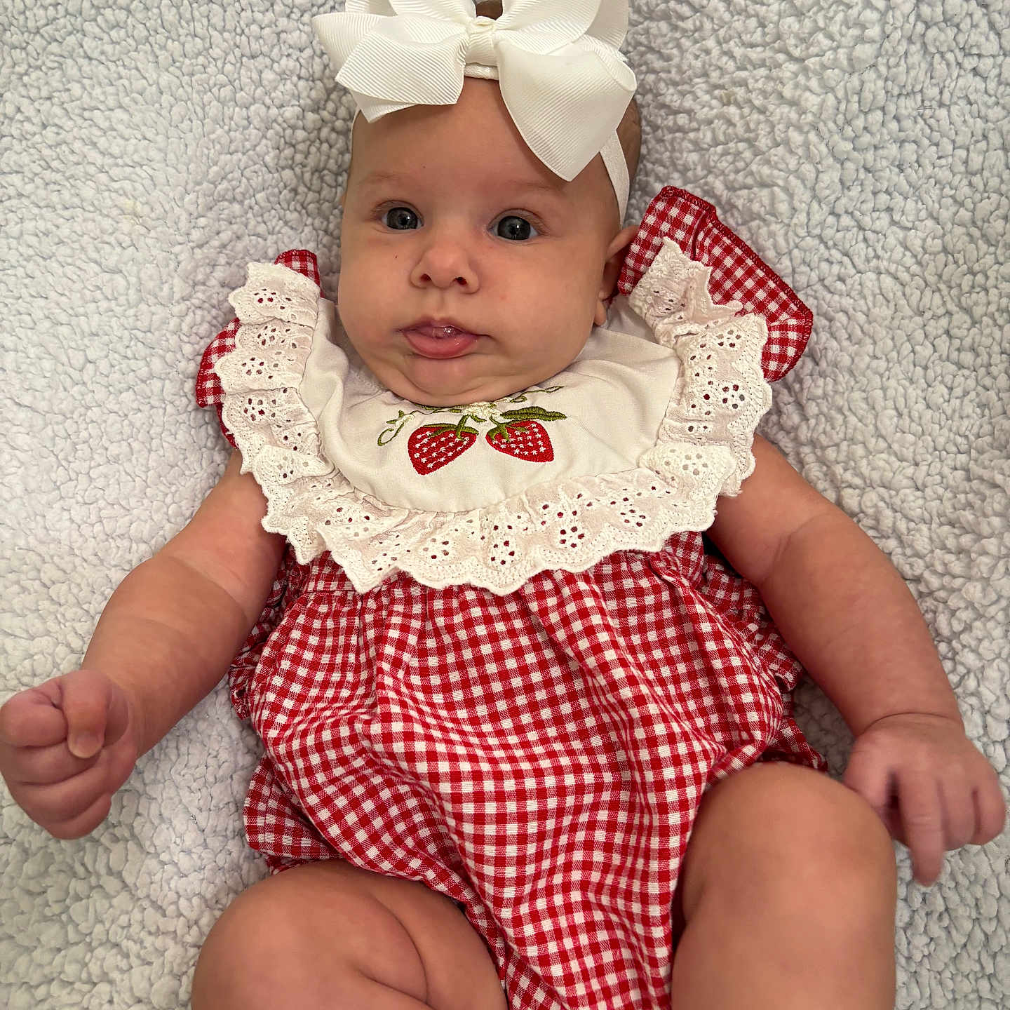Ivy Mae joined the competition — help win amazing prizes! arms, baby, blanket, bow, child, cute, dress, expression, face, headband, indoors, infant, lace, legs, newborn, portrait, red_gingham, skin, texture, white_socks