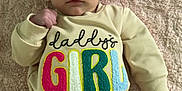 Ivy Mae is registered to the contest to win money with this photo: baby, infant, girl, pink_bow, onesie, blanket, text_clothing, daddy's_girl, foot, hand, headband, cute, lying_down, indoor, skin, expression, portrait, child, clothing, soft_texture