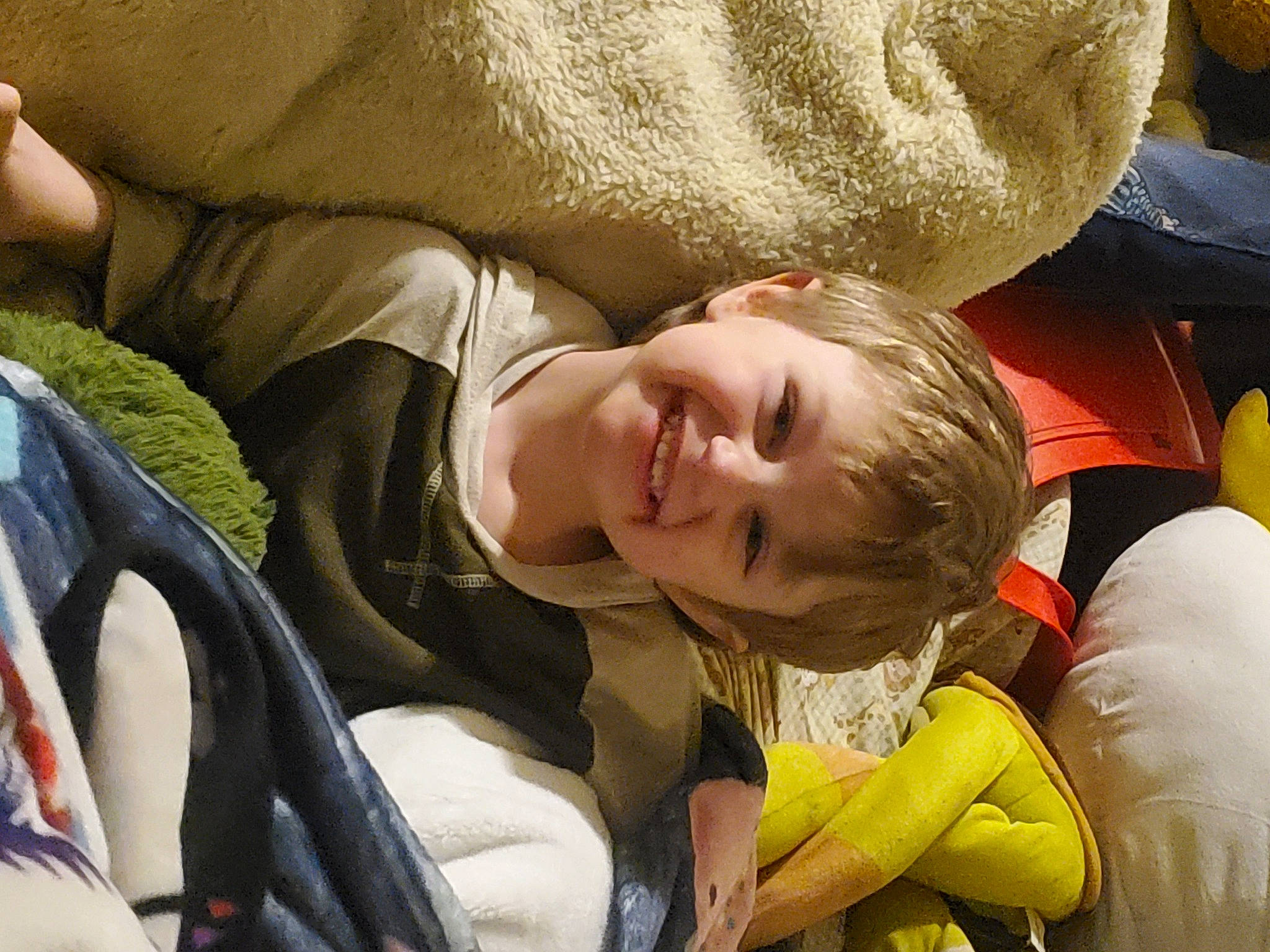 Alaka'I is registered to the contest to win money with this photo: baby_products, bag, child, comfort, facial_expression, fun, grass, happy, human_leg, joy, laugh, leisure, luggage_and_bags, nap, people_in_nature, person, recreation, sitting, sleep, smile