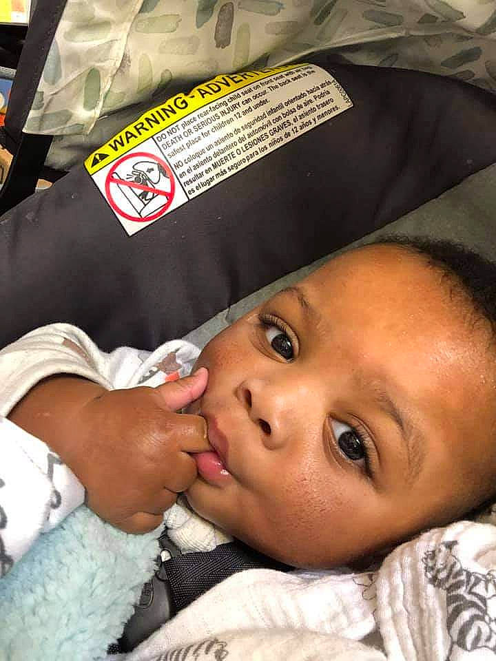 Willie is registered to the contest to win money with this photo: baby, cap, cheek, child, comfort, eyelash, face, fashion_accessory, gesture, happy, hat, headgear, linens, lip, mouth, nose, person, skin, textile, toddler