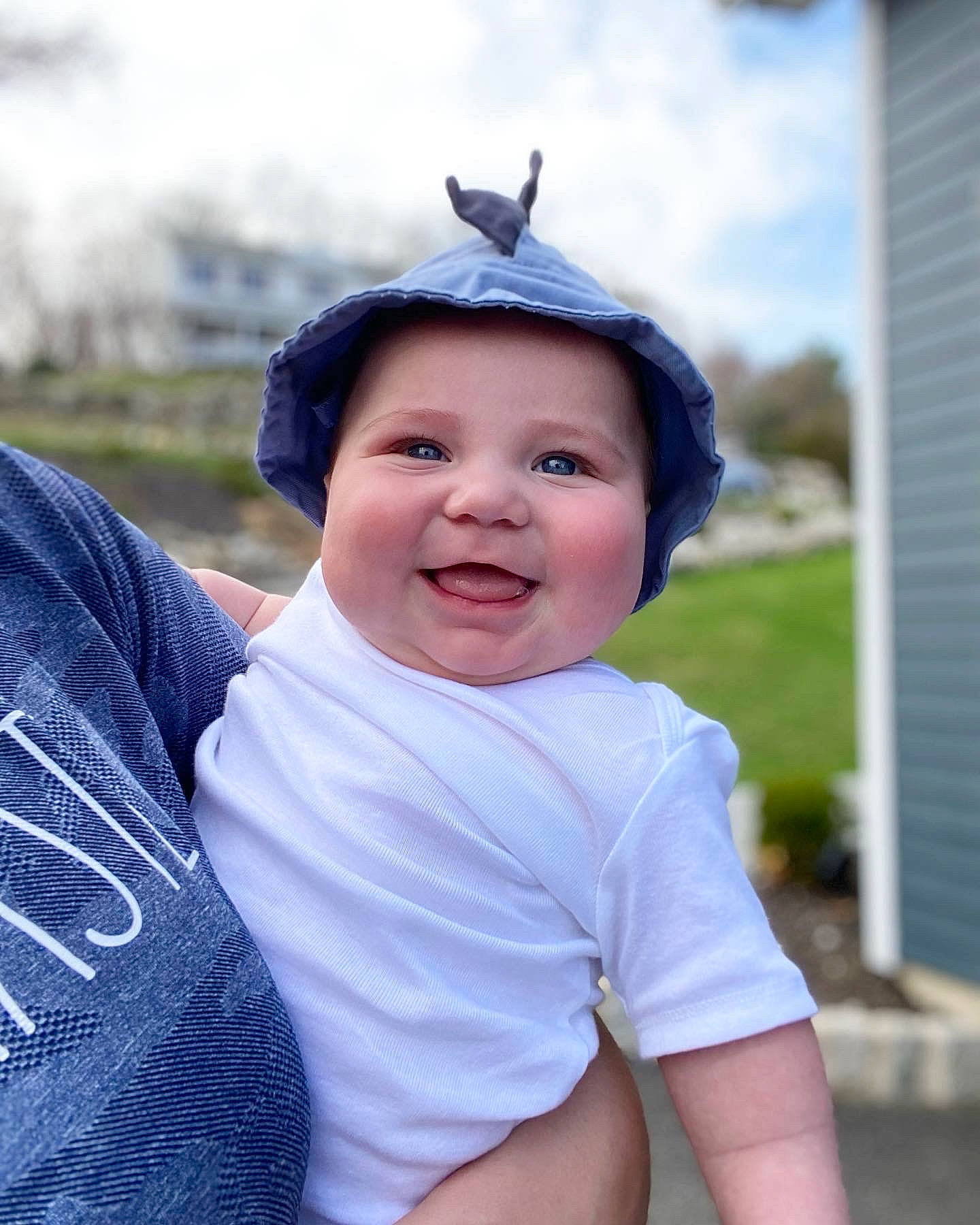 Cole joined the competition — help win amazing prizes! baby, cap, child, electric_blue, eye, fashion_accessory, flash_photography, fun, grass, happy, hat, head, headwear, joy, leisure, person, plant, recreation, sitting, sky